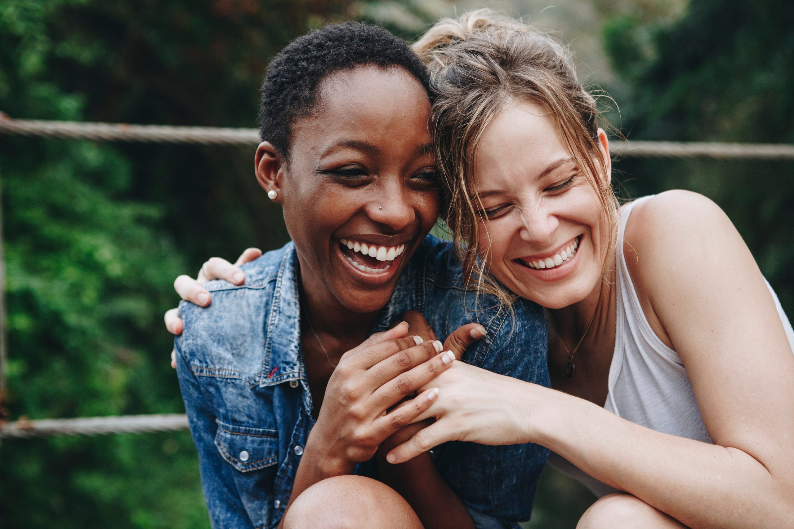 Two young women smiling and laughing